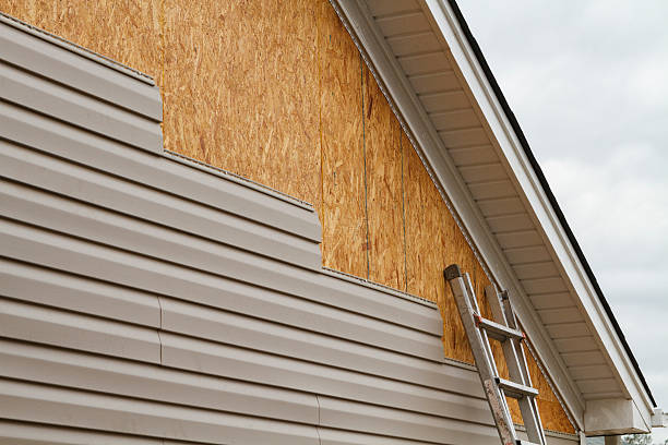 Professional Storm Damage Siding Repair technician working in Lawrenceburg, IN